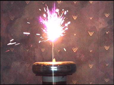 steel sparks off the white-hot tip